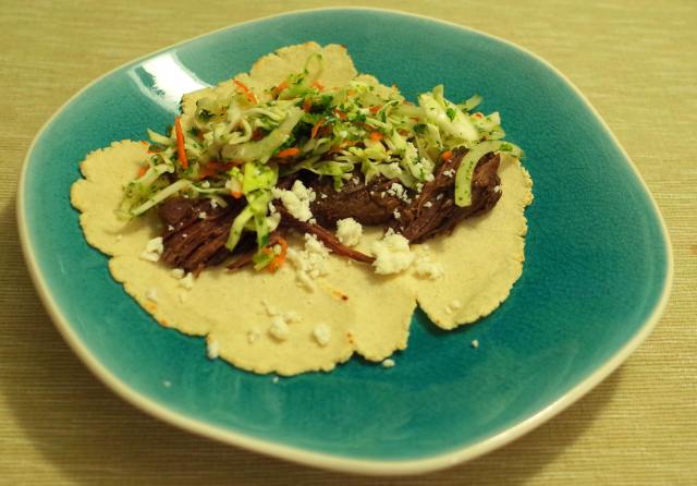 shredded beef tacos with cabbage-carrot slaw and cotija cheese